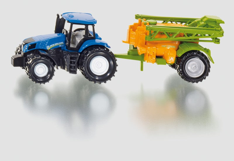 Traktor s přívěsem na rozprašování hnojiva