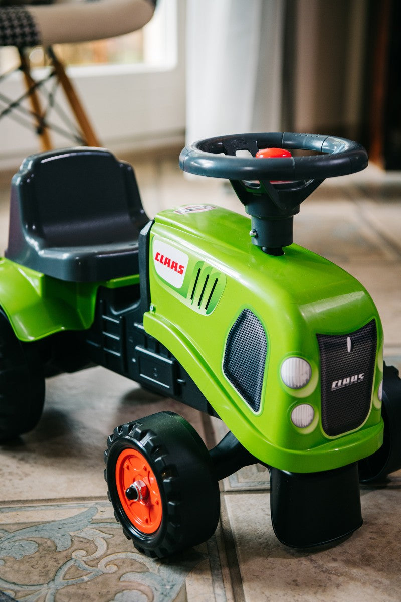 Odstrkovadlo traktor Claas zelené s volantem a valníkem