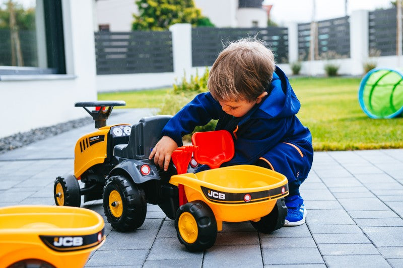 Odstrkovadlo traktor JCB žluté s volantem a valníkem