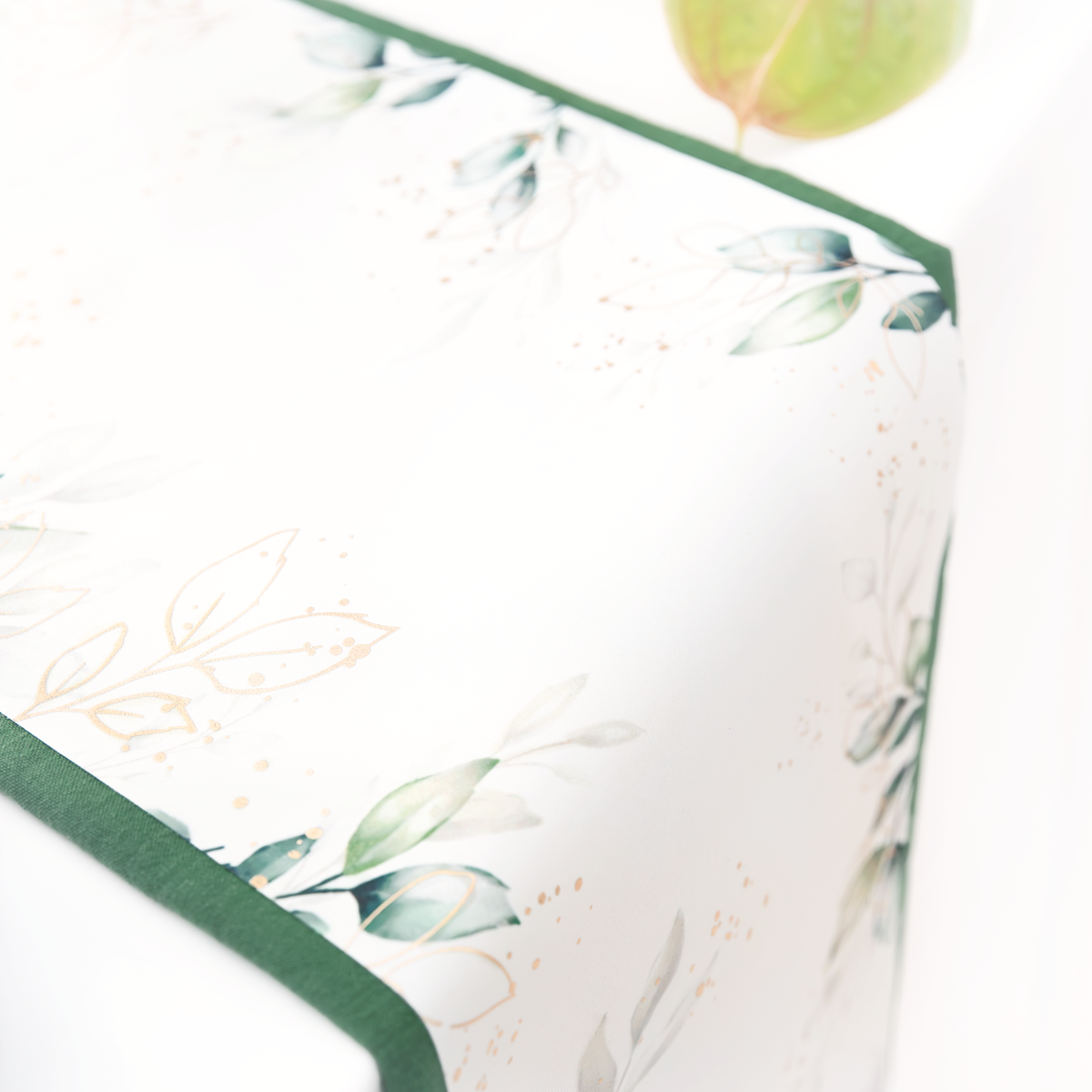 Leaf table runner with a gold floral motif, 275 x 28cm